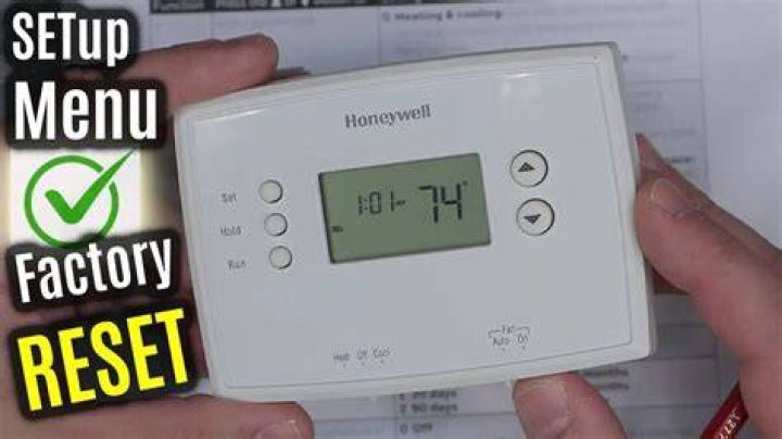 How do you reset a hardwired thermostat?