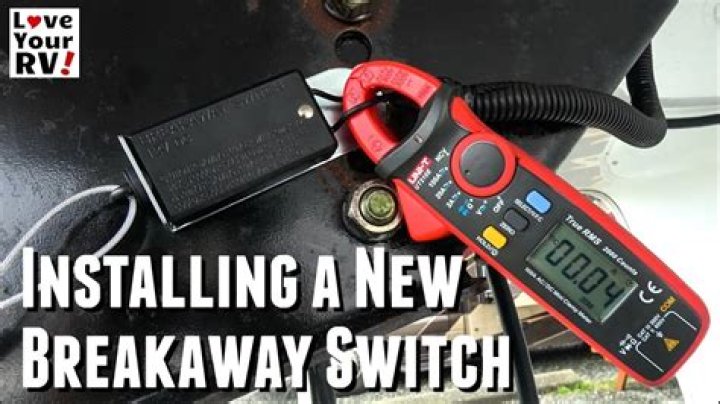How do you reset the breakaway switch on a trailer?