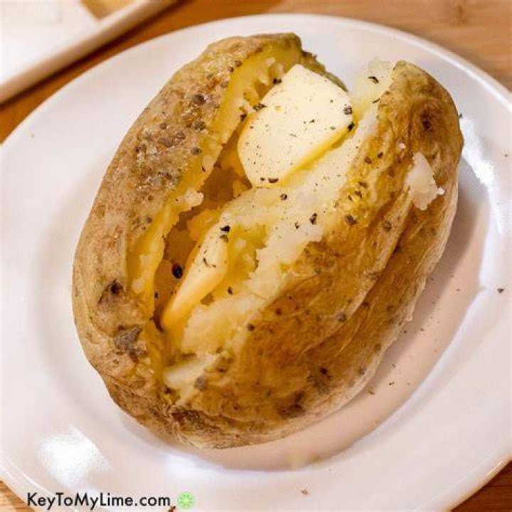 How does cutting one potato in half help control the variables in this experiment?